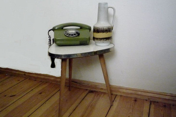 Guitar-pick coffee table with pencil legs. Doesn't get cuter than this!