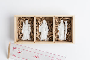 Each set comes in a wooden box