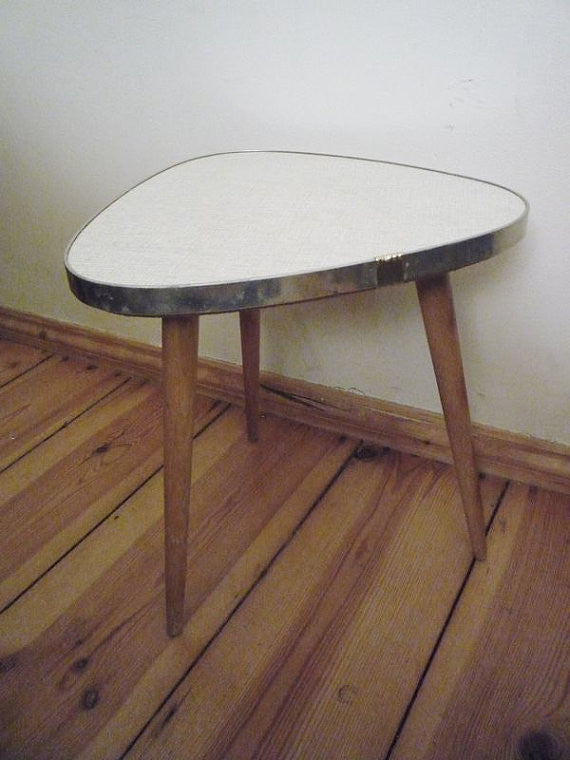 Guitar-pick coffee table with pencil legs. Doesn't get cuter than this!